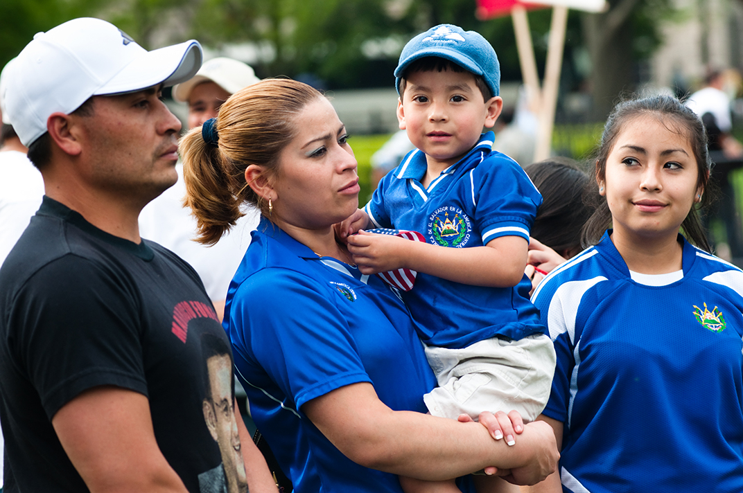 Family of four at a rally of immigrants and supporters